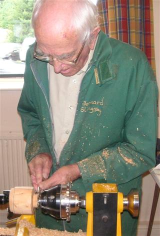Bernard showing how he makes his clocks